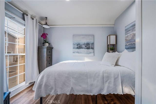 bedroom with wood-type flooring and ceiling fan