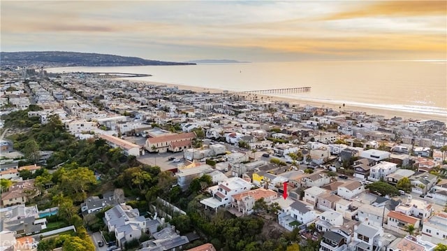 aerial view at dusk with a water view