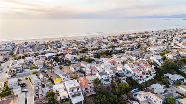 aerial view at dusk with a water view