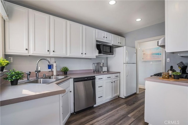 kitchen with dishwasher, sink, and white cabinets