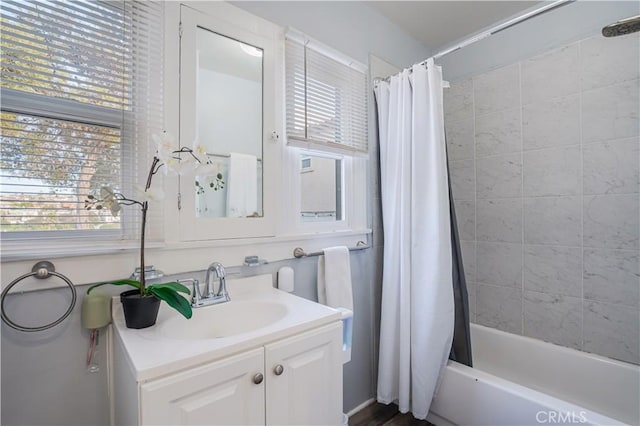 bathroom with vanity and shower / bath combination with curtain