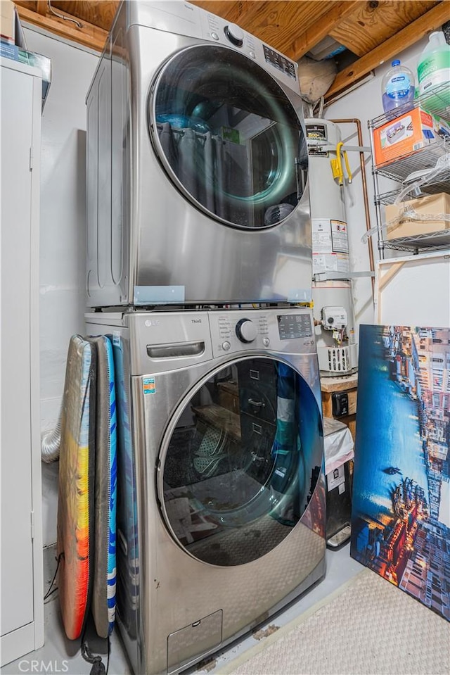 laundry area with stacked washer and clothes dryer