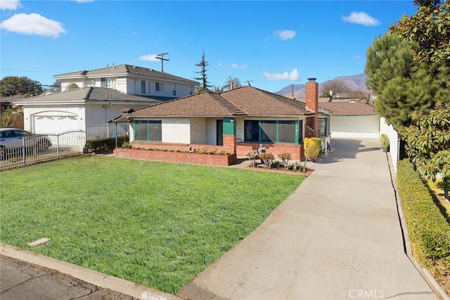 single story home featuring a garage and a front yard