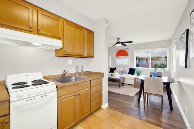 kitchen with sink, white range with electric stovetop, and ceiling fan