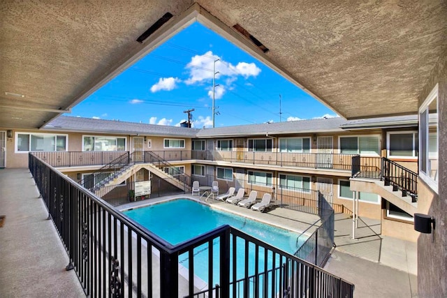 view of pool featuring a patio area