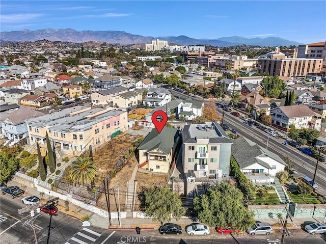 birds eye view of property with a mountain view