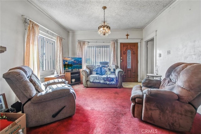 living room with a notable chandelier, carpet floors, crown molding, and a textured ceiling