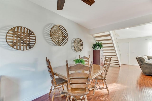 dining area featuring ceiling fan and hardwood / wood-style floors