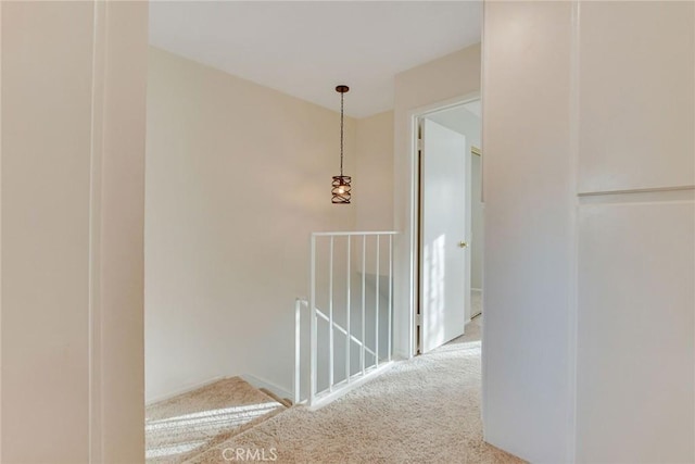 hallway featuring carpet