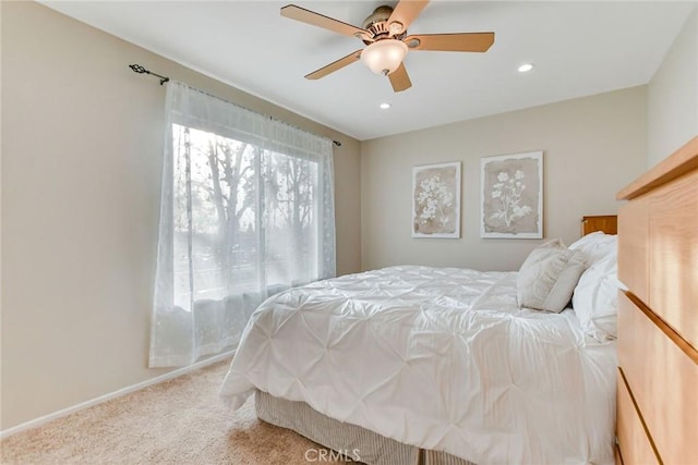 bedroom with ceiling fan and carpet