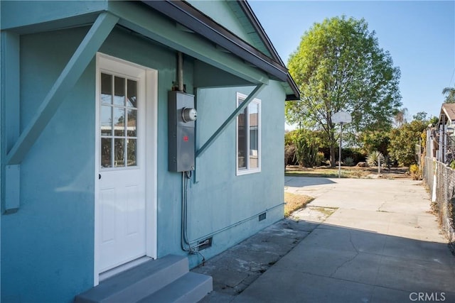 view of property exterior featuring a patio area