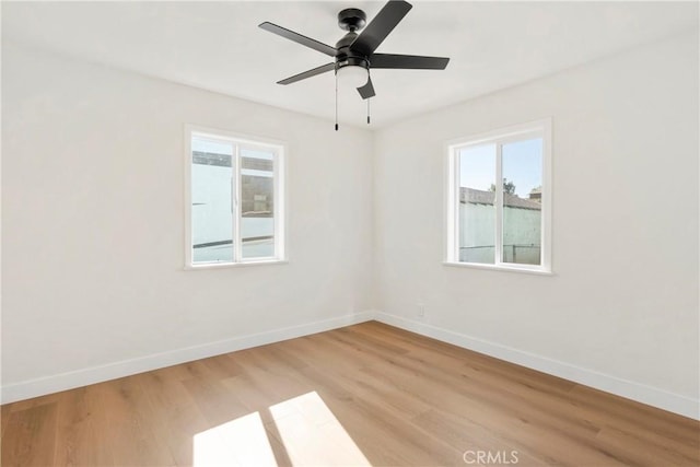 unfurnished room with light hardwood / wood-style flooring and ceiling fan