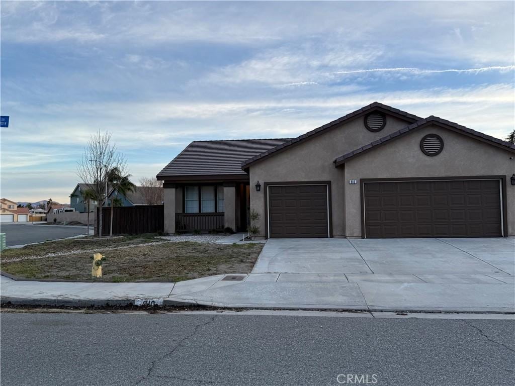 single story home featuring a garage