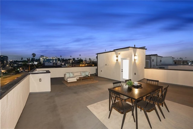 patio terrace at dusk with an outdoor living space