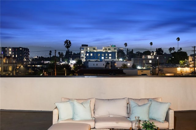 view of balcony at dusk