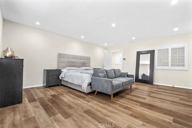 bedroom with wood-type flooring