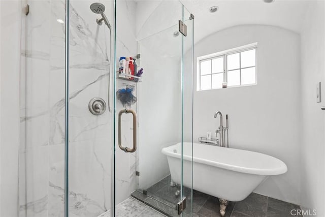 bathroom with shower with separate bathtub