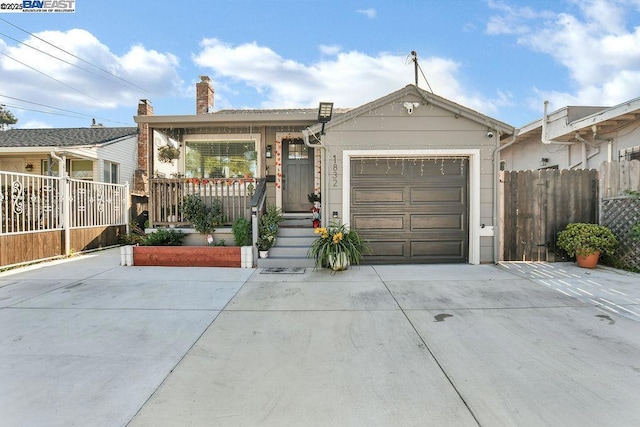 view of front of home with a garage and a porch