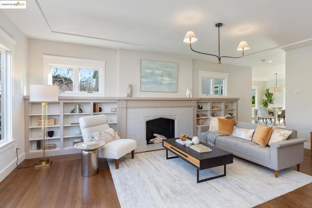 living room featuring hardwood / wood-style flooring and a fireplace