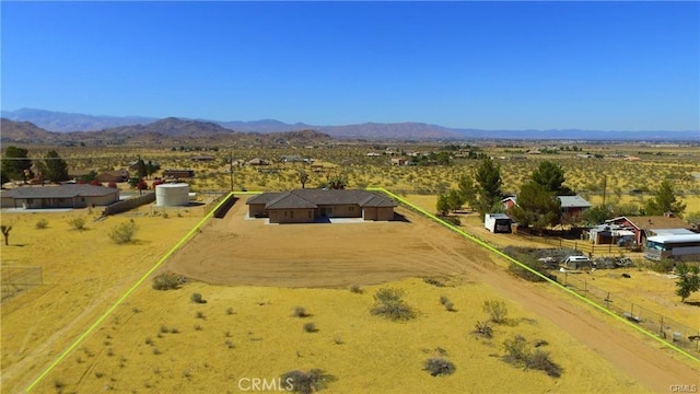 birds eye view of property with a mountain view