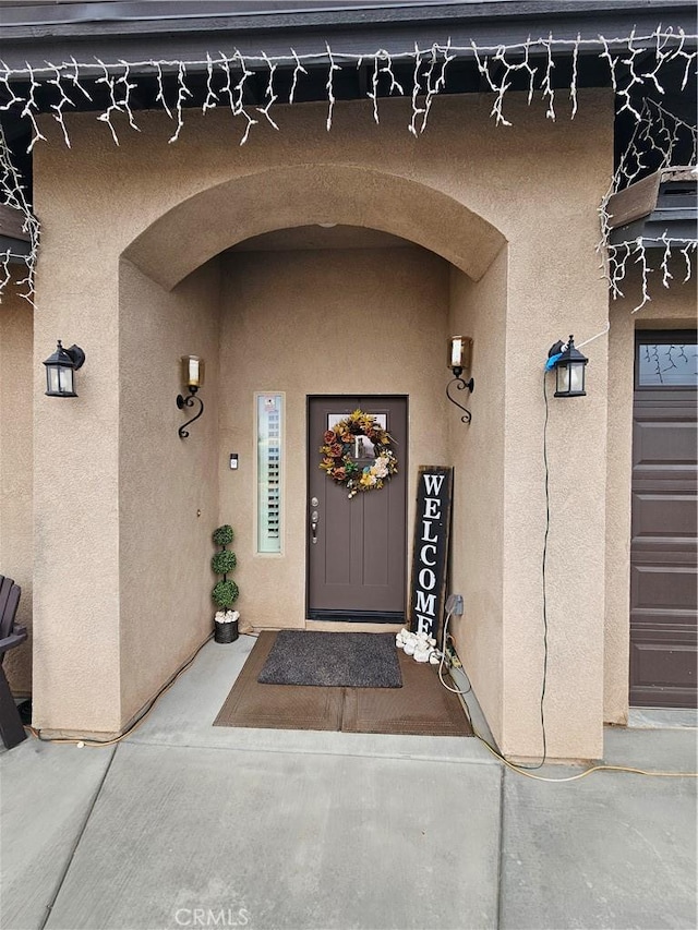 entrance to property featuring a garage