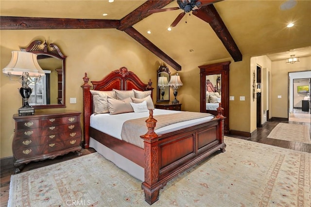 bedroom with lofted ceiling with beams, hardwood / wood-style floors, and ceiling fan