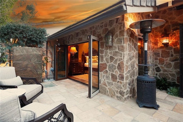 view of patio terrace at dusk