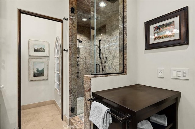 bathroom featuring an enclosed shower and tile patterned floors