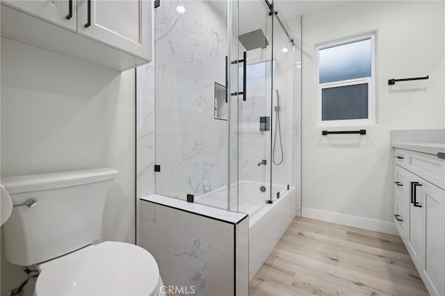 full bathroom with vanity, toilet, combined bath / shower with glass door, and wood-type flooring