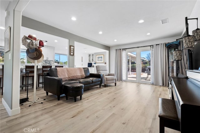 living room with light hardwood / wood-style floors