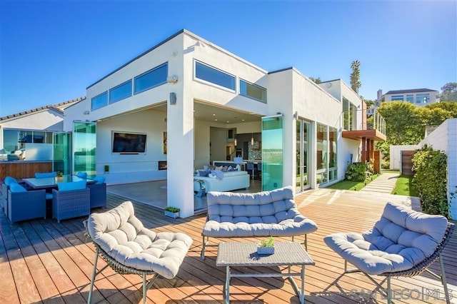 deck featuring an outdoor living space