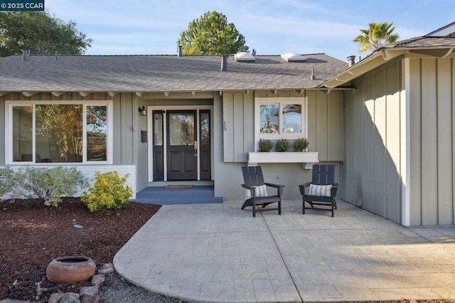 entrance to property featuring a patio area