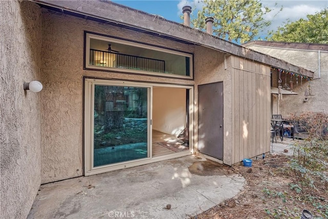 doorway to property featuring a patio area