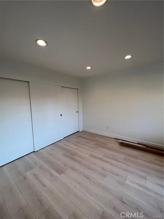 unfurnished bedroom featuring light hardwood / wood-style floors