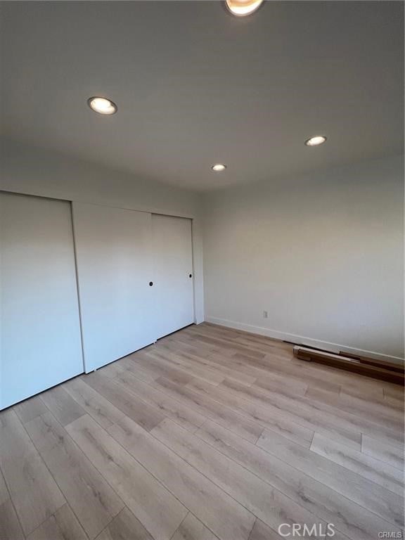 unfurnished room featuring light hardwood / wood-style floors