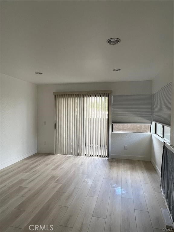 22848 Hilton Head Dr Unit 179, Diamond Bar, CA 91765 - spare room featuring baseboards, plenty of natural light, and wood finished floors