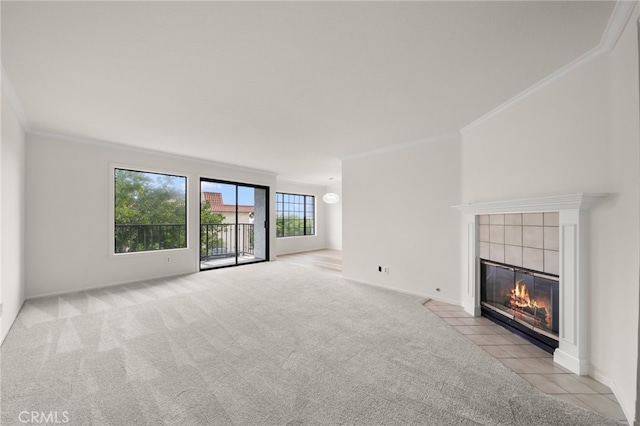 unfurnished living room with a fireplace, light carpet, and ornamental molding