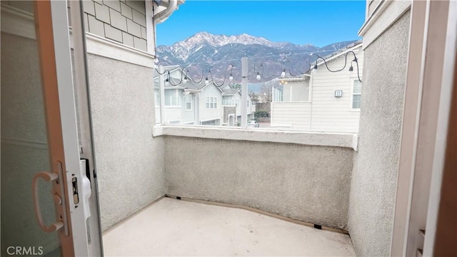 balcony featuring a mountain view