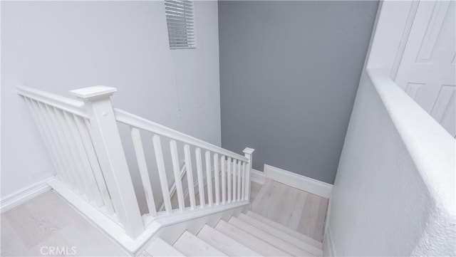 7331 Shelby Pl Unit U56, Rancho Cucamonga, CA 91739 - staircase featuring wood finished floors and baseboards
