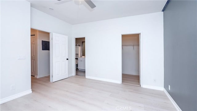 7331 Shelby Pl Unit U56, Rancho Cucamonga, CA 91739 - unfurnished bedroom featuring light wood finished floors, a spacious closet, baseboards, and a closet