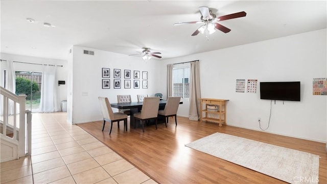 dining room featuring plenty of natural light, light hardwood / wood-style floors, and ceiling fan