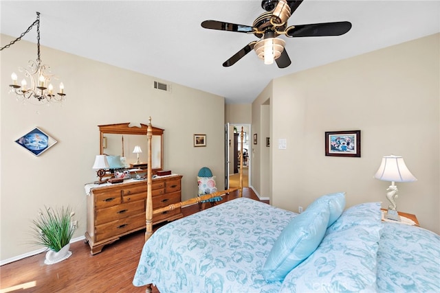 bedroom with wood-type flooring and ceiling fan