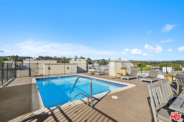 view of swimming pool featuring a patio