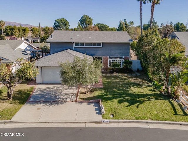 front facade with a garage and a front lawn