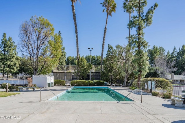 view of swimming pool with a patio area