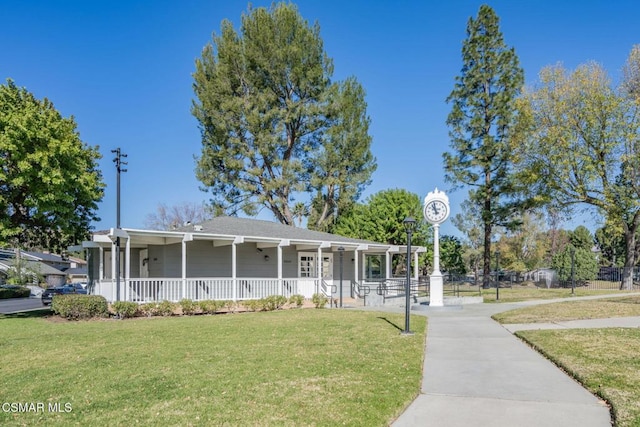 view of front of property featuring a front yard and a porch