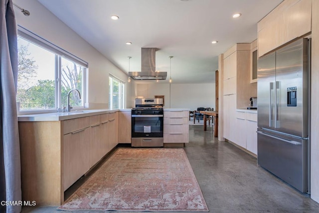 kitchen featuring appliances with stainless steel finishes, hanging light fixtures, island exhaust hood, kitchen peninsula, and light brown cabinets