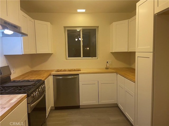 kitchen featuring wooden counters, dishwasher, gas stove, and white cabinets