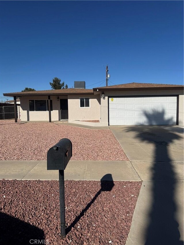 single story home with a garage