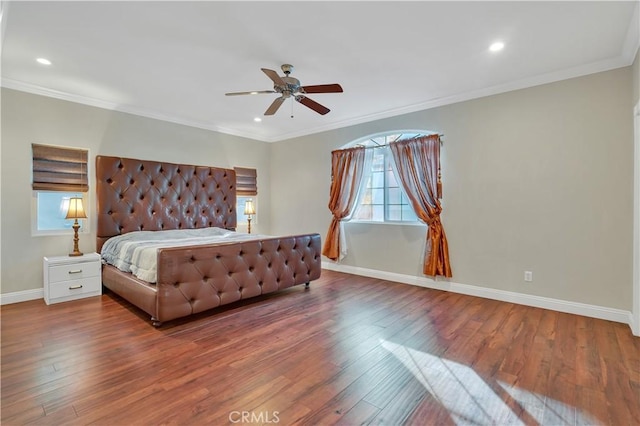 bedroom featuring crown molding, hardwood / wood-style floors, and ceiling fan